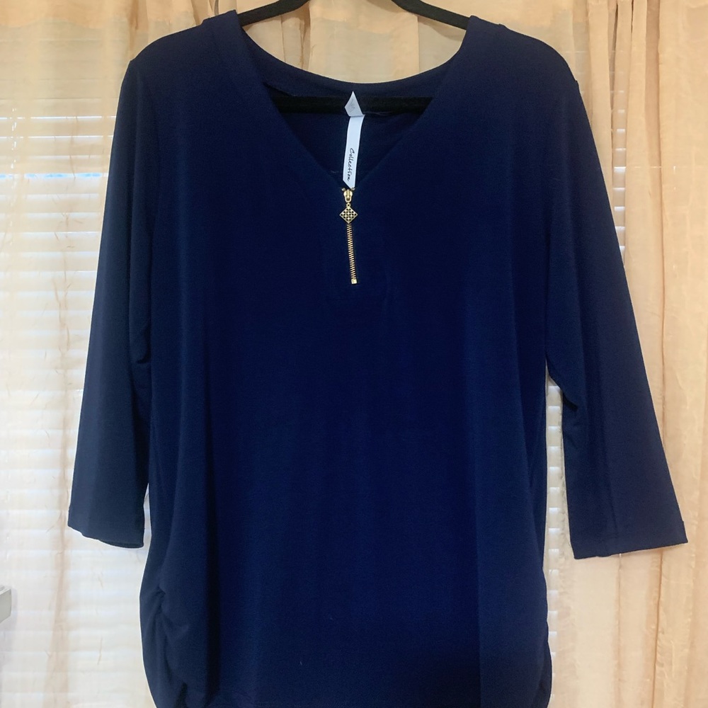 Blue quarter length sleeve shirt. Size Large. With gold front zipper.